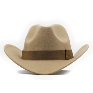 Detail of wool felt cowboy hat with upturned brim and dark brown decorative band