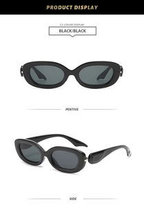 Detail view of oval black sunglasses with glossy frames and dark grey lenses in dual angles