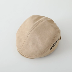 Detail of khaki suede beret hat showing Boston 1928 embroidery and soft fabric texture