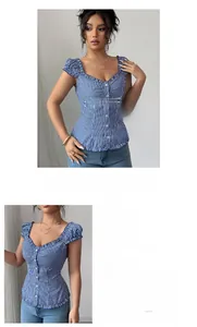 Detail of blue striped fitted blouse featuring square neck and ruffled sleeve edges