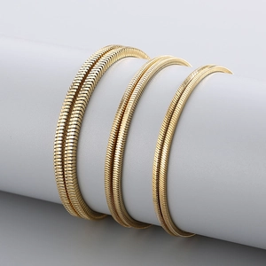Set of three golden stainless steel square snake chain necklaces in various thicknesses