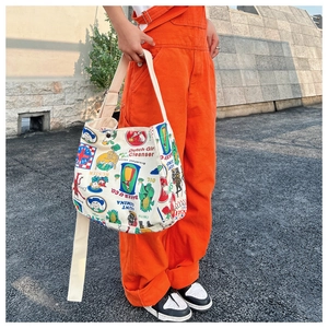 Close-up of retro printed canvas tote bag featuring colorful American vintage patterns