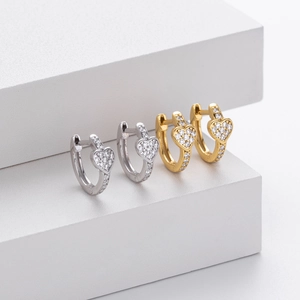 Close-up of S925 silver heart hoop earrings with cubic zirconia in gold and silver