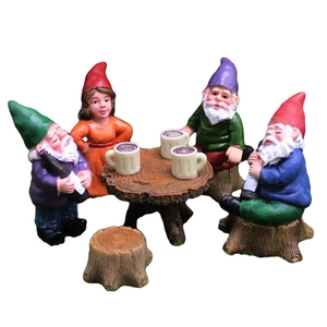 7-piece set of colorful resin garden gnomes with a miniature table and tree stump stools