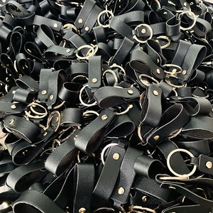 Minimalist black PU leather keychains with golden metal rings and polished rivets