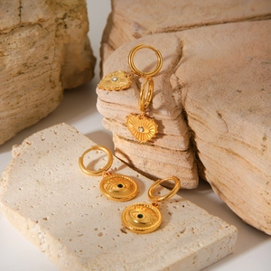 Gold evil eye earrings with heart and round charms on natural stone base