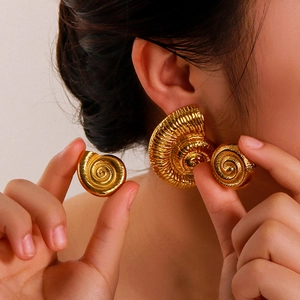 Golden spiral shell earrings with 18k gold plating for a refined ocean beach style look