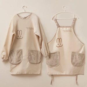 Waterproof kitchen apron with cartoon rabbit design and plush pockets in beige color