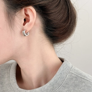 Polished silver square acrylic stud earring displayed on model for stylish minimalist look