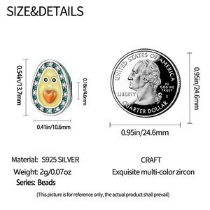 Detail view of avocado charm dimensions 13.7mm by 10.6mm with coin size comparison
