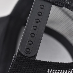 Close-up of adjustable black snapback closure and breathable mesh fabric on a baseball cap
