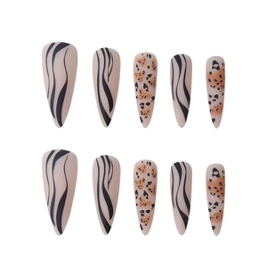 Matte almond press-on nails featuring mixed black zebra and brown leopard animal prints