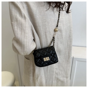Detail of black quilted leather mini crossbody bag with gold chain and ball adjustment buckle