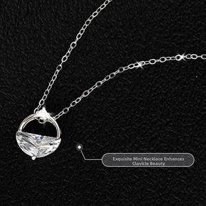 Macro shot of silver-tone necklace with semi-circle cubic zirconia on black leather