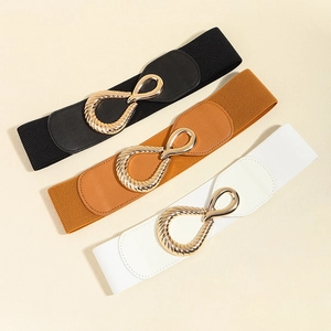 Three elastic waist belts in black, brown, and white with elegant gold twist buckles