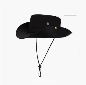 Detail of a black wide-brim sun hat with bronze metal buttons and adjustable chin strap