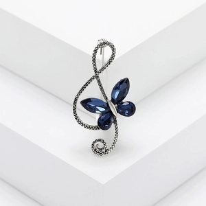 Vintage treble clef and butterfly brooch with blue crystals and antique silver finish