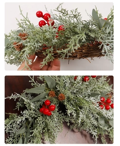 Detail of Christmas garland with red berries, pine cones and natural rattan base