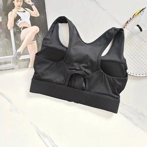 Detail of black front-zip sports bra featuring breathable mesh and racerback design