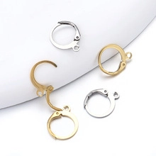 Close-up of gold and silver stainless steel round hoop earring hooks for DIY jewelry