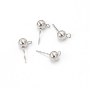 Close-up of four silver stainless steel ball stud earrings with loops for DIY jewelry making