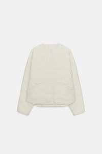 Detail of wave quilted pattern and round neck on beige casual women coat