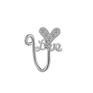 Macro shot of silver heart and Love nose ring with white zircon stones on white background