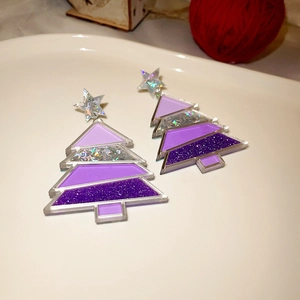 Detailed view of Christmas tree earrings with purple gradient sequins and silver star charms