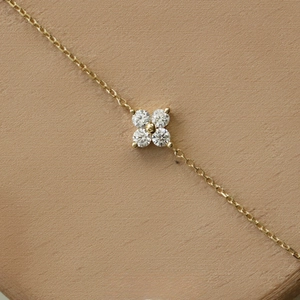 Elegant 14K gold plated S925 silver bracelet featuring a mini diamond four-leaf clover charm