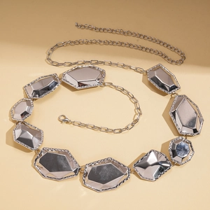 Close-up of silver geometric metal chain with mirror polished irregular polygon plates
