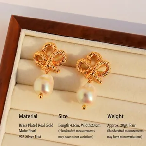 Baroque pearl earrings with vintage twisted knot bow in gold plated brass finish