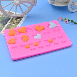 Pink heart-shaped silicone mold with 18 cavities for DIY chocolate and cake decoration