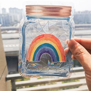 Macro view of a suncatcher rainbow prism PVC sticker featuring a glass jar with rainbow design