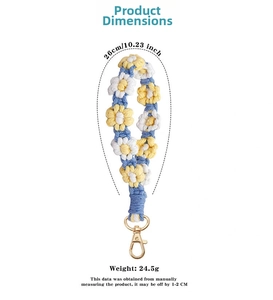 Detailed view of handmade crochet daisy phone strap with lobster clasp and sizing metrics