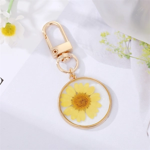 Colorful resin mushroom keychain with real yellow dried daisy flower and gold alloy clasp