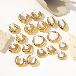 Collection of golden stainless steel earrings including hoop and textured designs