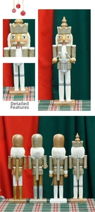 Macro detail of wooden Nutcracker king figurines featuring gold and silver glitter finish