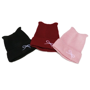 Cute cat-ear knit beanie for women with bow embroidery in black, red, and pink