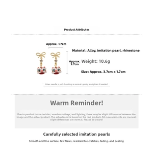 Detail view of lion dance earrings with dimensions 3.7cm x 1.7cm and material specs