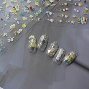 Floral rabbit nail art stickers with daisies and tulips on clear press-on nails