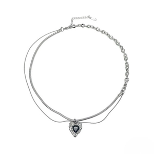 Double-layered silver snake chain necklace featuring a black heart-shaped gemstone pendant
