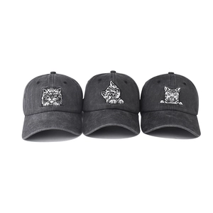 Detailed view of three washed charcoal cotton baseball caps with cat face embroidery