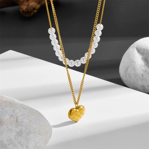 Double-layer stainless steel necklace featuring white pearls and a 3D gold heart pendant