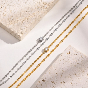 Minimalist double-layered stainless steel necklace with gold and silver cubic zirconia pendants