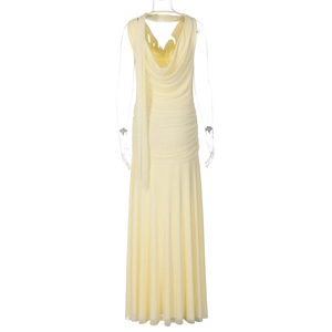 Detail of light yellow cowl neck dress with side rushing and floor length silhouette