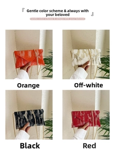Detail showing four envelope bags with crocodile embossing in orange, white, black, and red