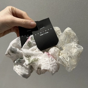 Lace floral scrunchie with pink flowers and a bow ribbon accessory for women
