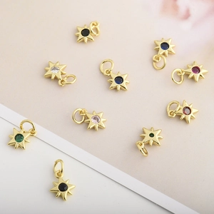 Detailed view of assorted colorful zircon star pendants with gold plated finish