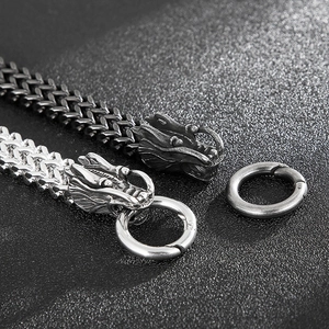 Detailed close-up of retro dragon head bracelets in silver and antique black finishes