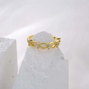 Gold plated open geometric ring with hollow oval design and sparkling cubic zirconia